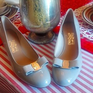 Salvatore Ferragamo Light Gray Patent Heels with Bow Details.